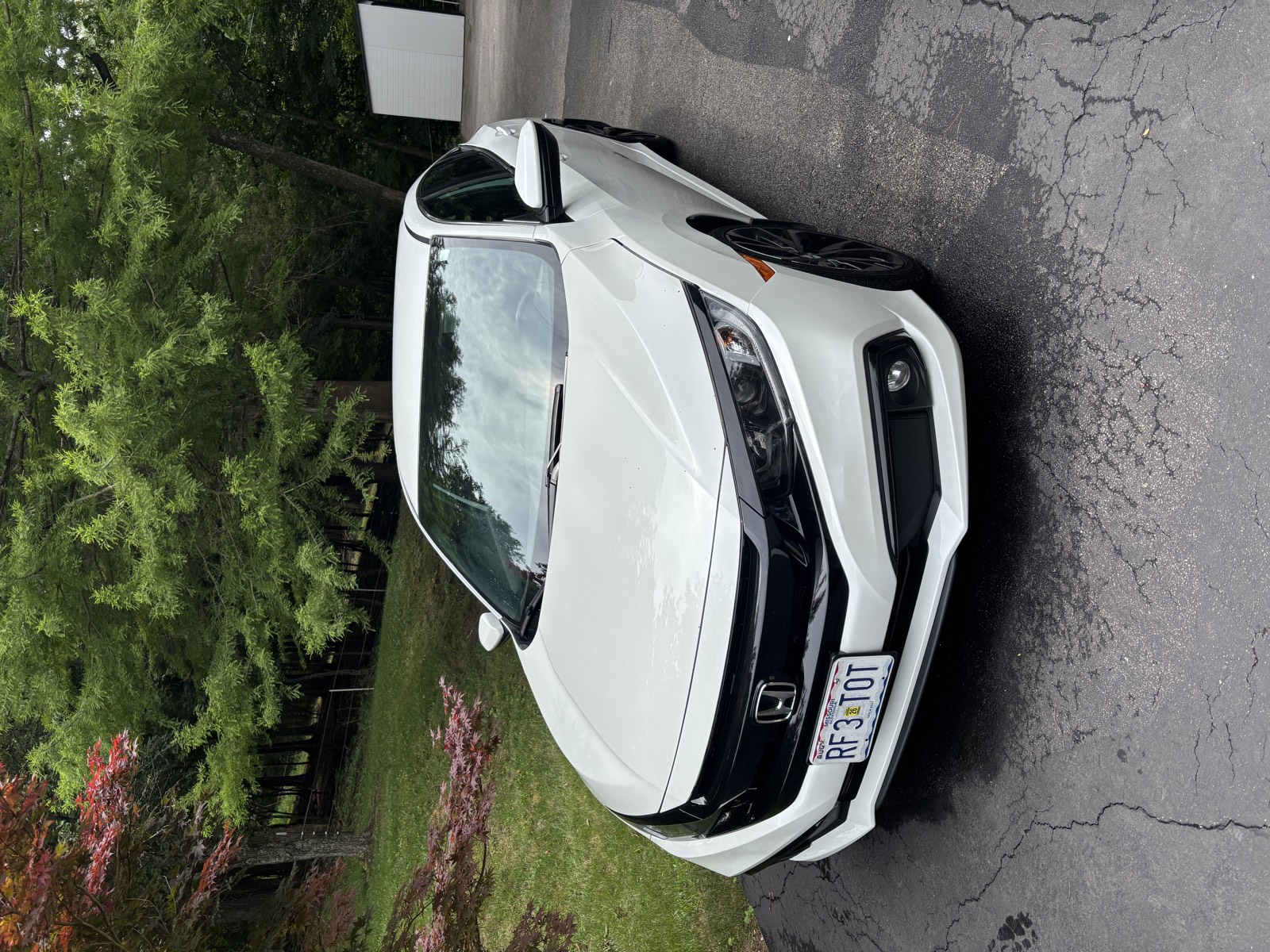 White Honda Civic gleaming after a full mobile detail in West St. Louis County
