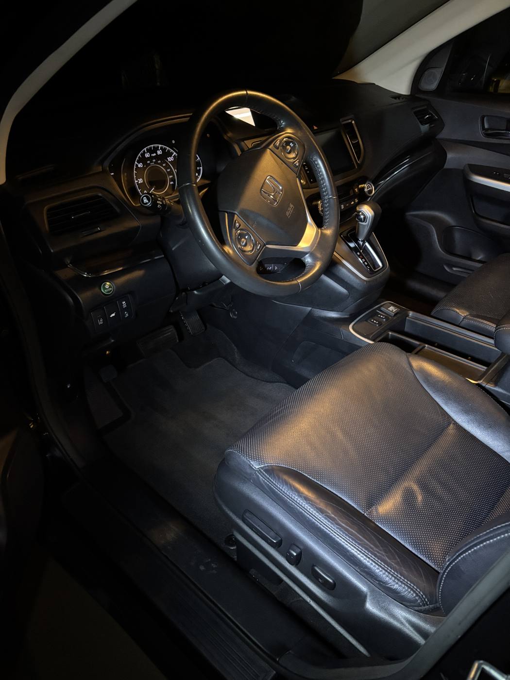 Driver seat and floor cleaned after detailing