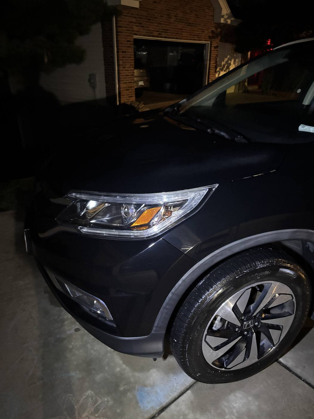 Clean glossy front end and headlight after detailing