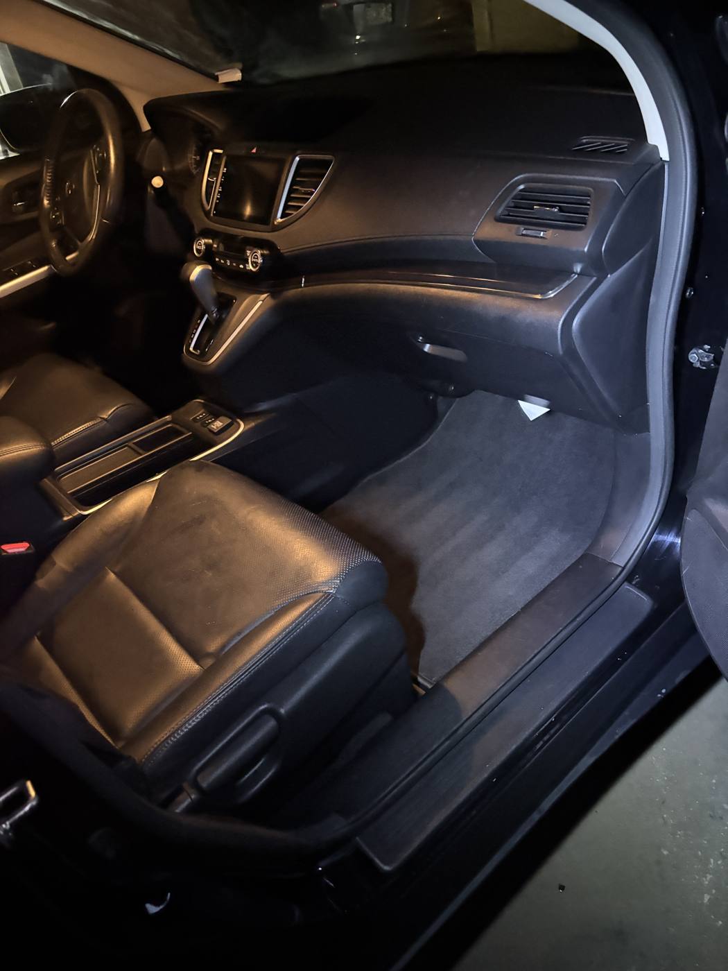 Passenger floor vacuumed and hair-free after detailing