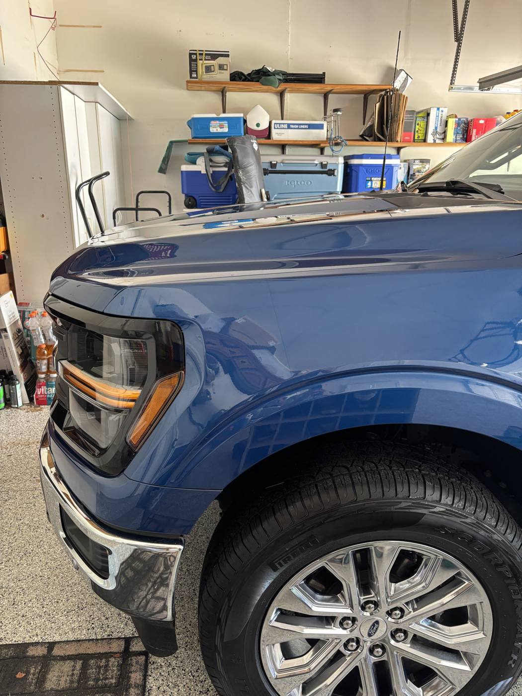 Ford F-150 front fender and chrome wheel detailed to a shine