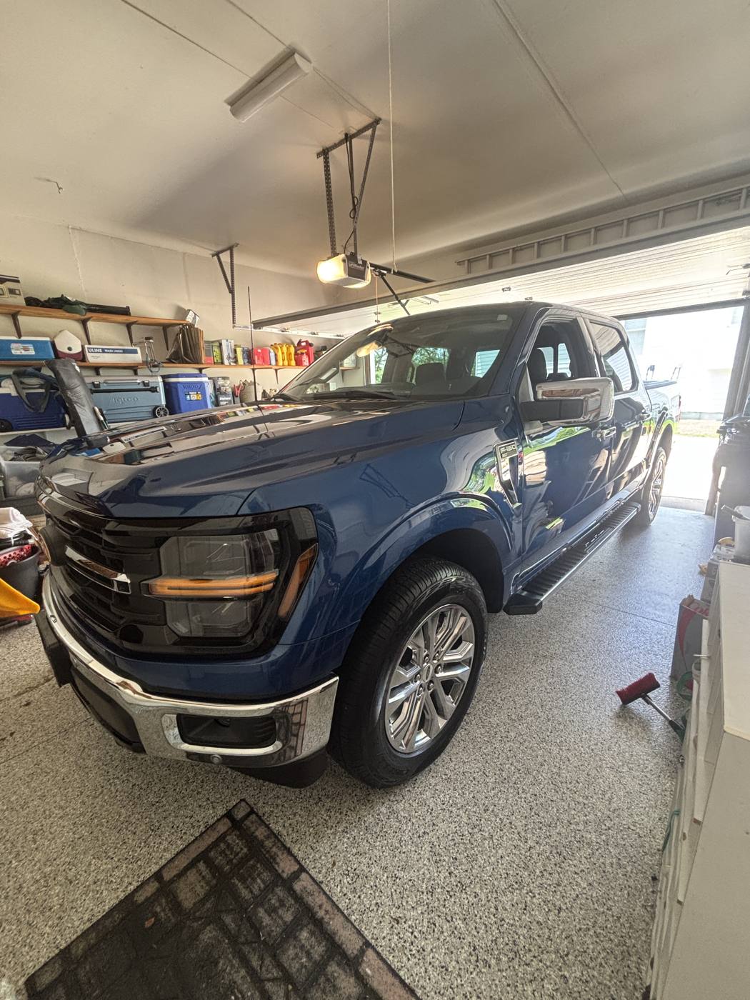 Blue Ford F-150 gleaming after a full detail