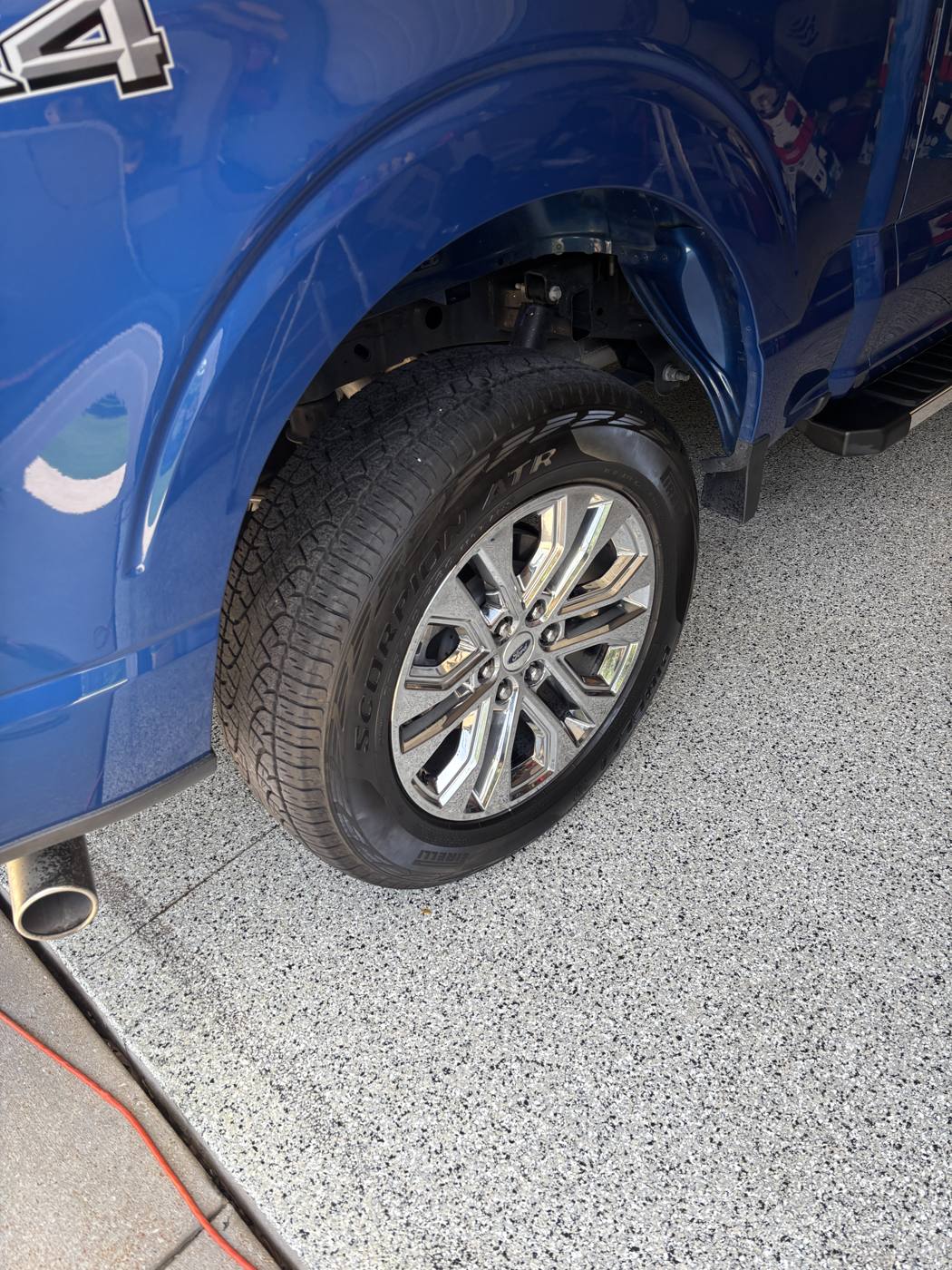 Chrome Ford F-150 wheel and dressed tire after detailing